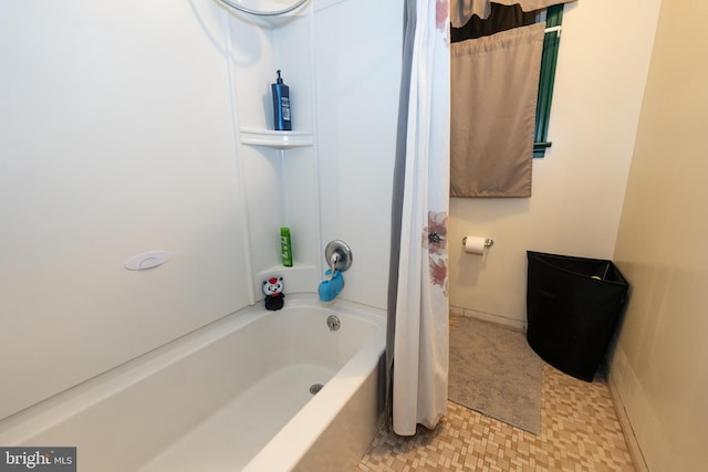 bathroom with shower / bath combination with curtain