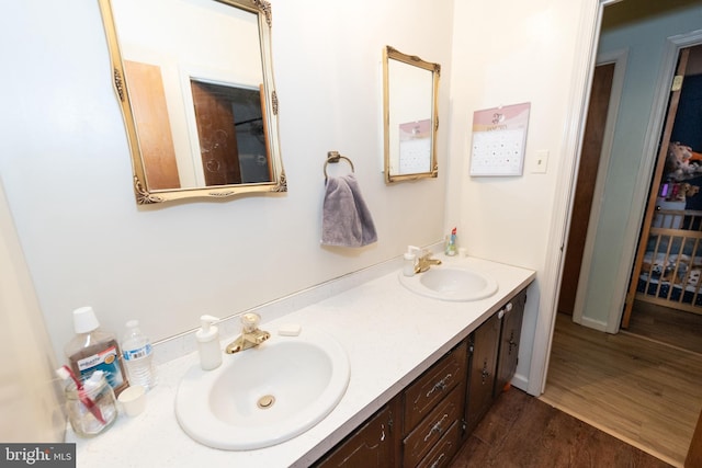 bathroom with vanity and hardwood / wood-style floors