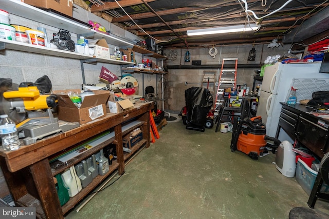 basement featuring white refrigerator