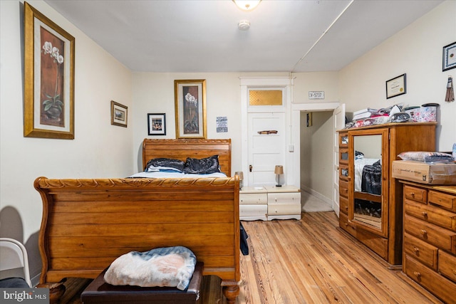 bedroom with light wood-type flooring