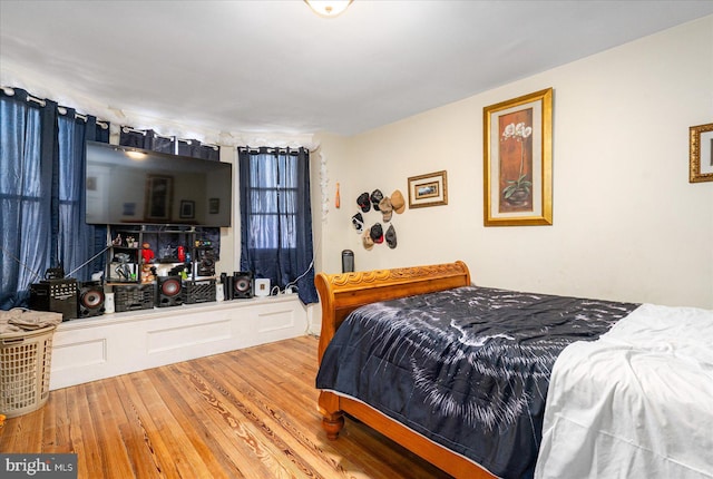 bedroom with hardwood / wood-style floors