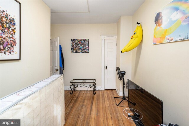 corridor featuring hardwood / wood-style flooring