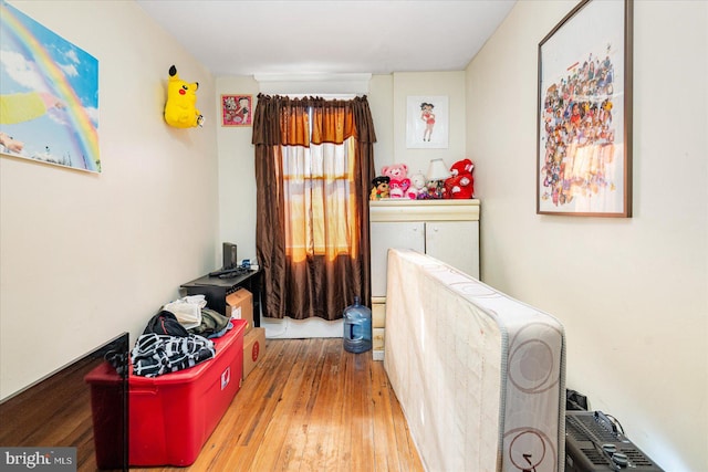 bedroom with wood-type flooring