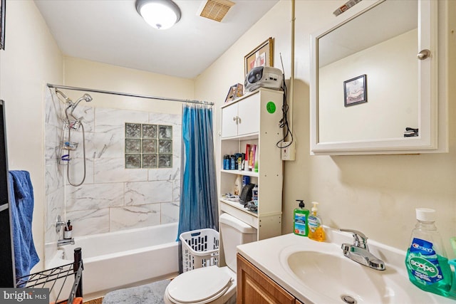 full bathroom featuring vanity, toilet, and shower / bath combo with shower curtain