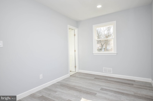 unfurnished room featuring light hardwood / wood-style flooring