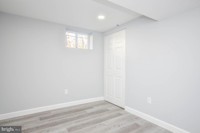 unfurnished room with light hardwood / wood-style flooring