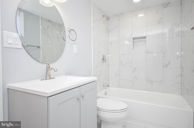 full bathroom with vanity, toilet, and tiled shower / bath combo