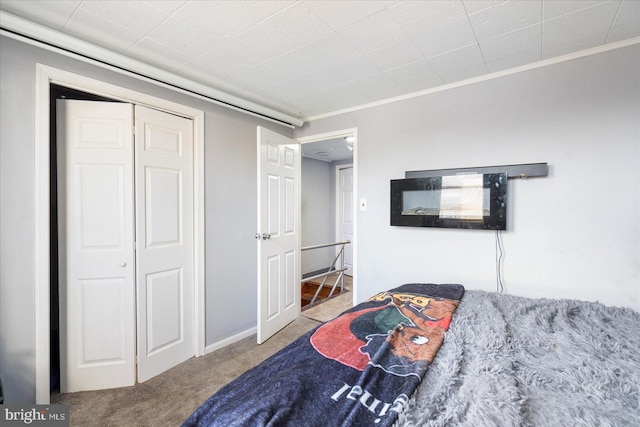 carpeted bedroom featuring ornamental molding