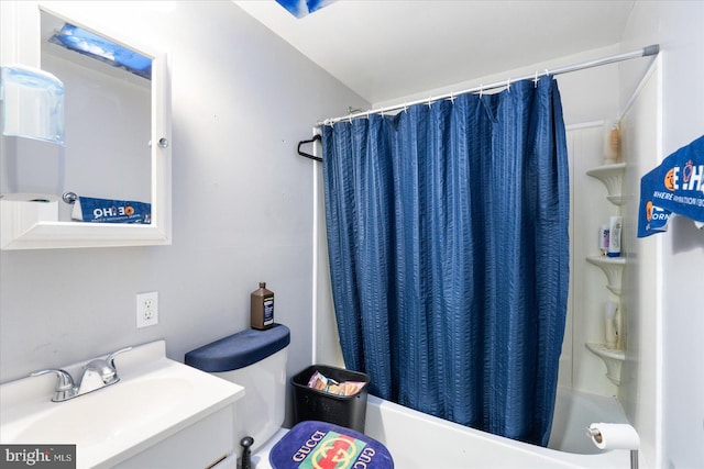 full bathroom featuring vanity, shower / bath combo, and toilet