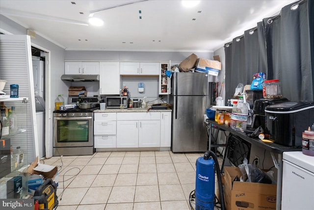 kitchen featuring white cabinetry, stainless steel appliances, crown molding, and light tile patterned floors