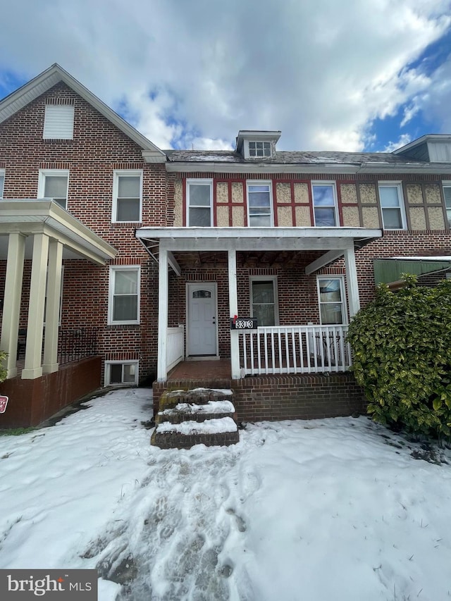 view of property featuring covered porch