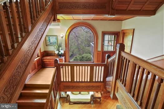 interior space featuring wood ceiling, hardwood / wood-style flooring, and beamed ceiling