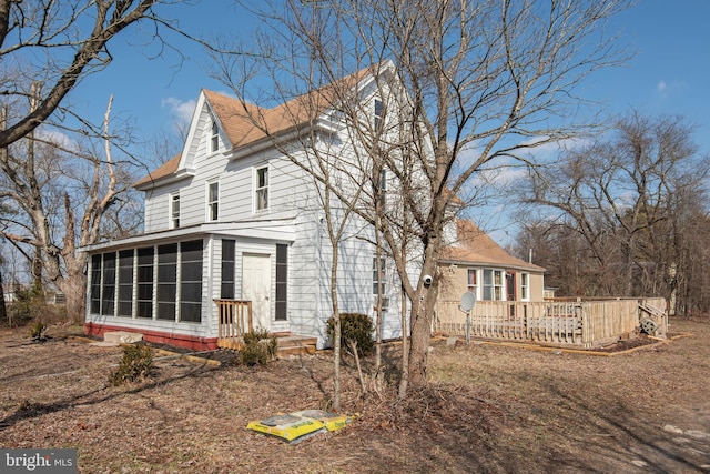 exterior space featuring a sunroom