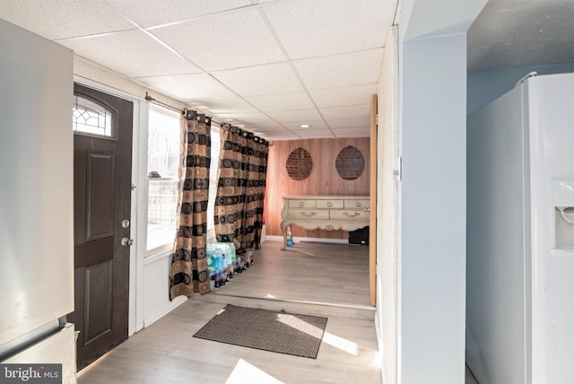 foyer featuring a paneled ceiling and light hardwood / wood-style floors