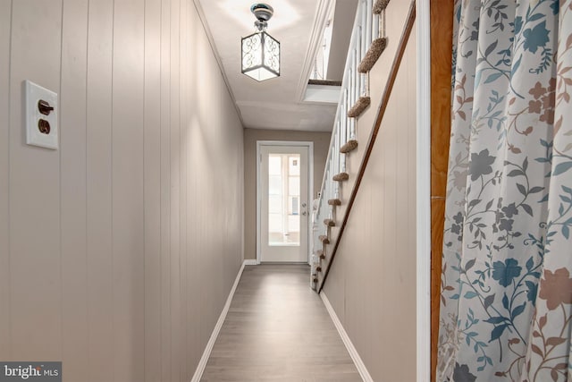 corridor with hardwood / wood-style floors