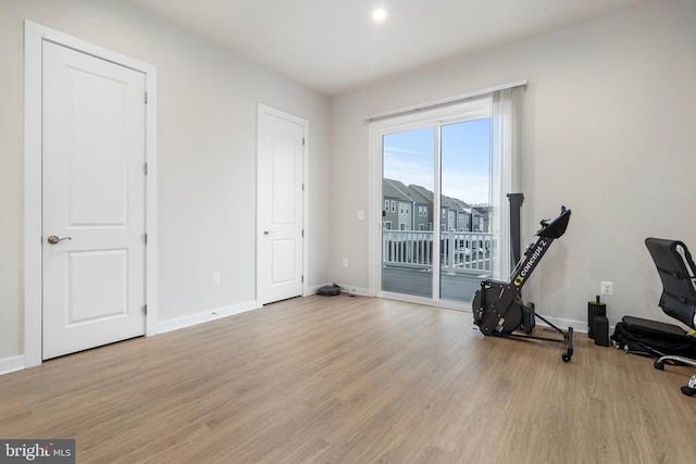 workout area with light wood-type flooring