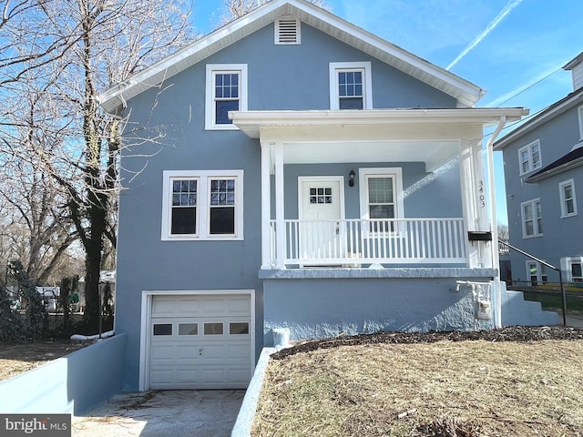 view of front of property featuring a garage and covered porch