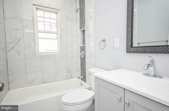 full bathroom featuring plenty of natural light, toilet, tiled shower / bath combo, and vanity