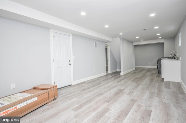 basement featuring light hardwood / wood-style flooring