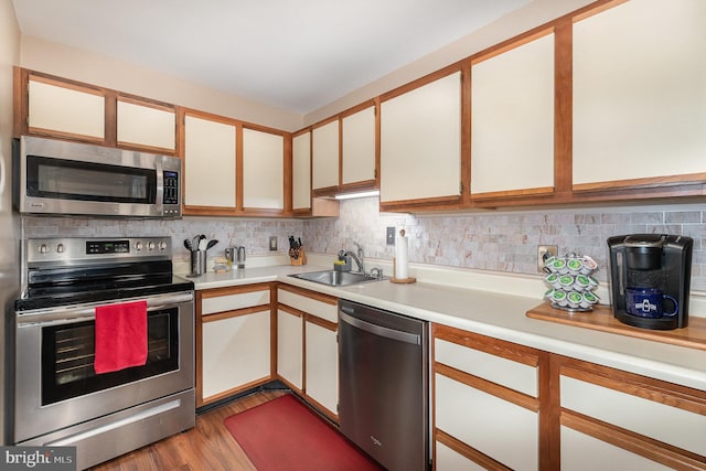 kitchen with white cabinetry, appliances with stainless steel finishes, and sink