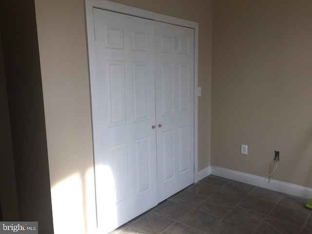 unfurnished bedroom featuring a closet