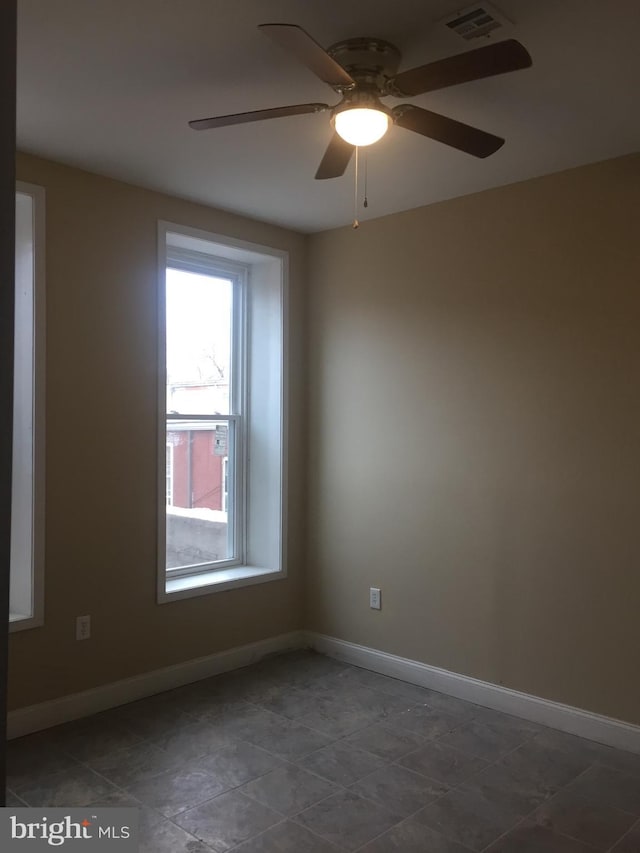 unfurnished room with ceiling fan