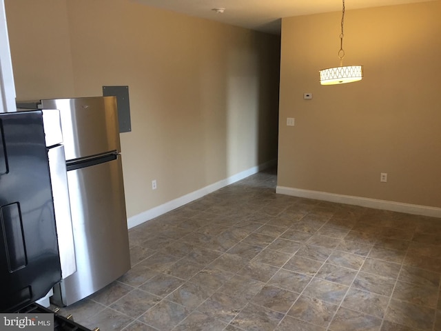 kitchen with pendant lighting and stainless steel refrigerator