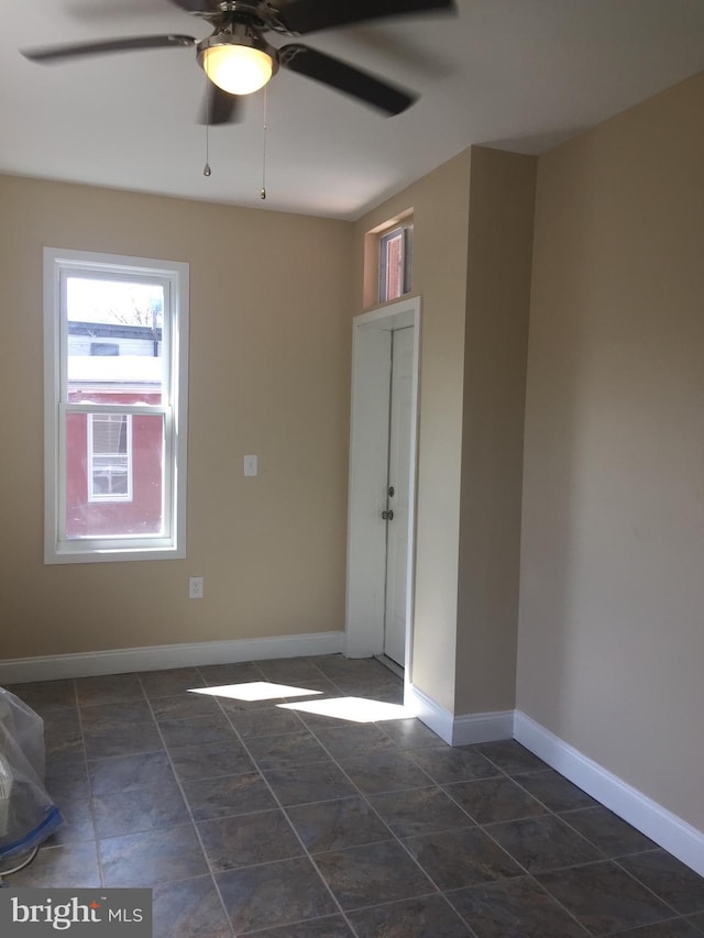 unfurnished room featuring ceiling fan