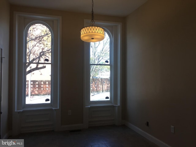 interior space with dark tile patterned floors