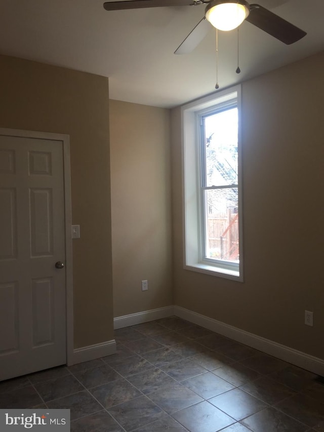 empty room with ceiling fan