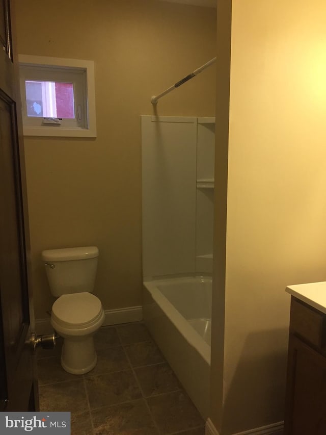 bathroom with vanity, toilet, and tile patterned flooring