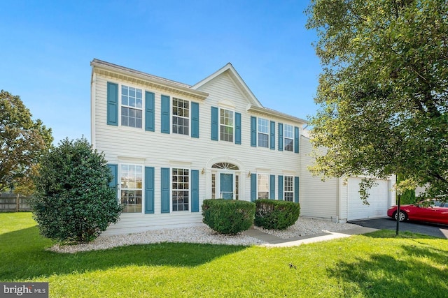 colonial inspired home with a front yard