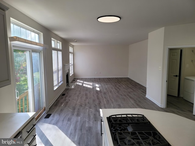 interior space featuring washer and clothes dryer and light wood-type flooring