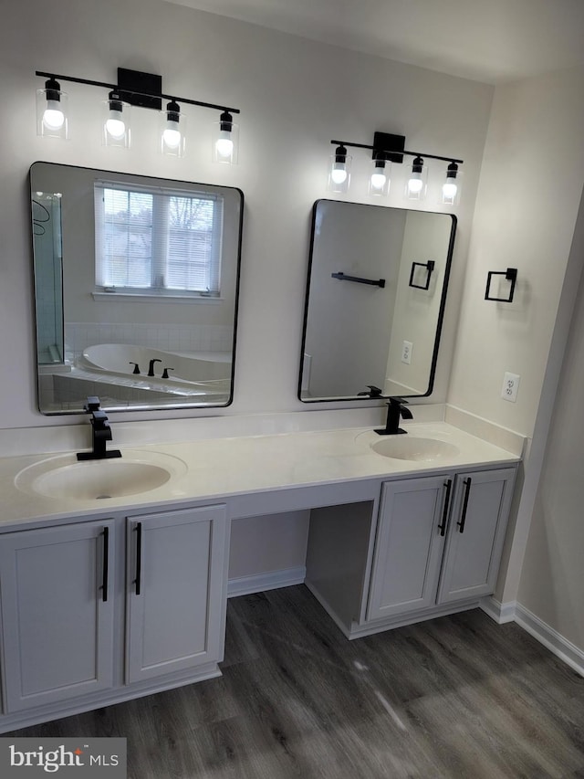 bathroom with vanity and hardwood / wood-style floors