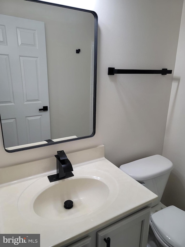 bathroom with vanity and toilet