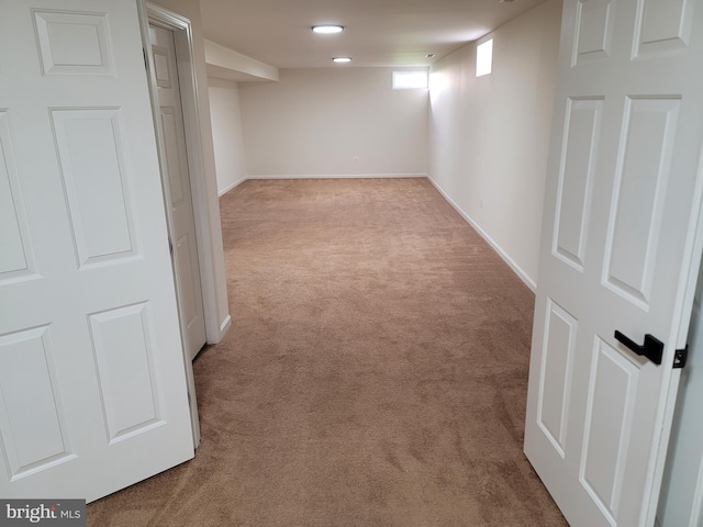 basement with light colored carpet