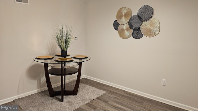 details featuring wood finished floors, visible vents, and baseboards