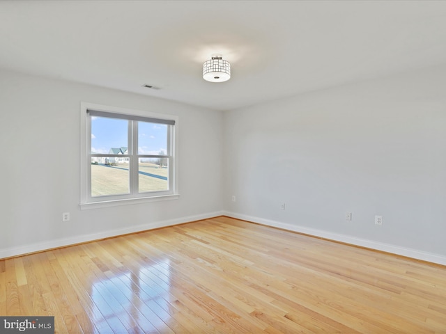 unfurnished room with light hardwood / wood-style flooring