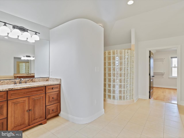 bathroom with tile patterned flooring and vanity