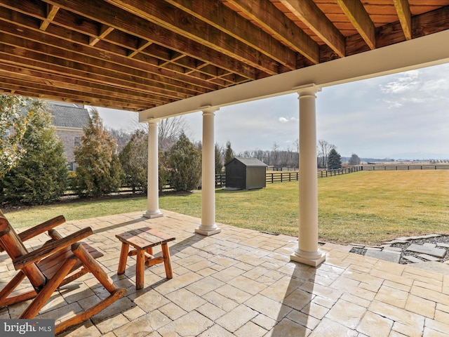 view of patio with a storage shed