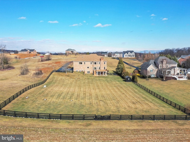 birds eye view of property featuring a rural view