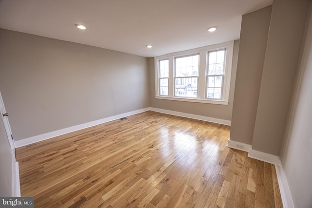 spare room featuring light hardwood / wood-style flooring