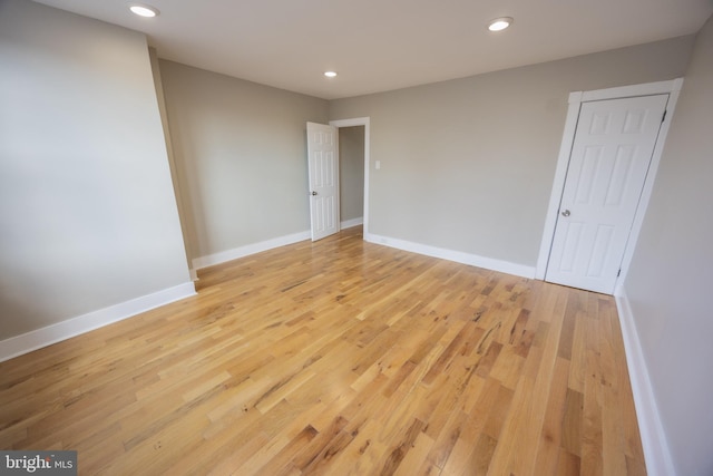 spare room with light hardwood / wood-style flooring