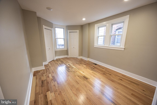 spare room featuring light hardwood / wood-style floors