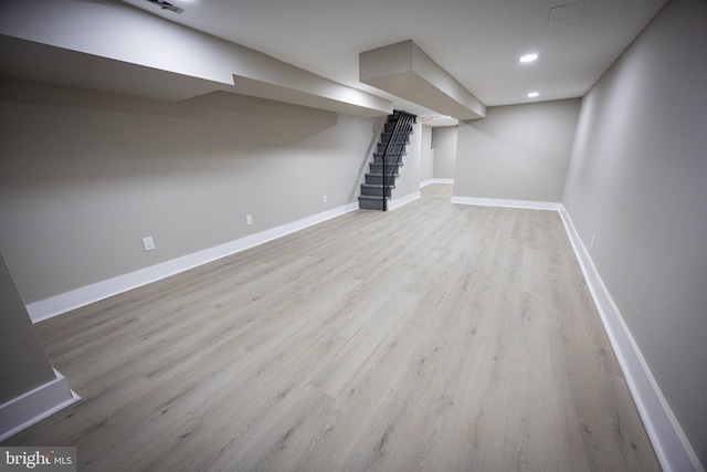 basement featuring light wood-type flooring