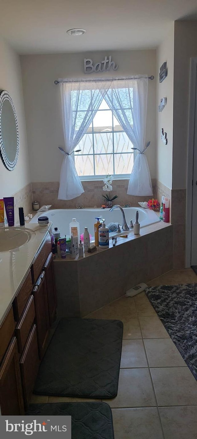 bathroom featuring tile patterned flooring and vanity