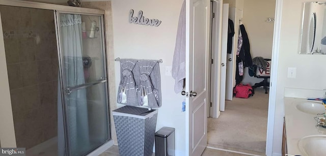 bathroom featuring vanity and walk in shower