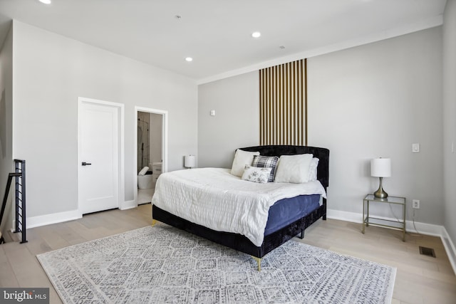 bedroom featuring light hardwood / wood-style floors