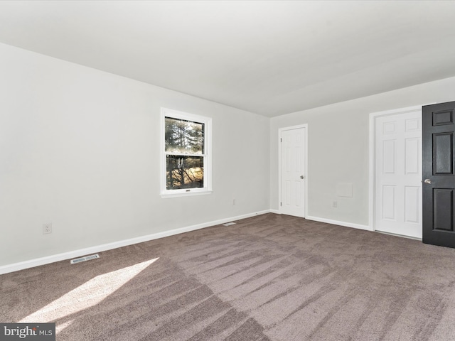 spare room with carpet floors