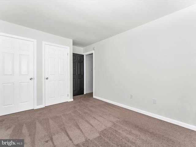 unfurnished bedroom featuring carpet floors